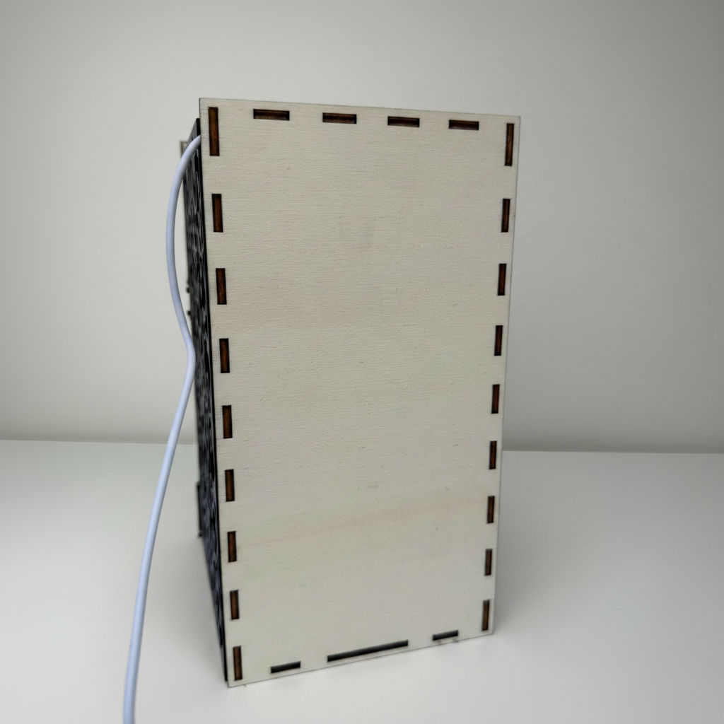 Rectangular wooden box with a cable on a white background