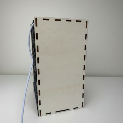 Rectangular wooden box with a cable on a white background