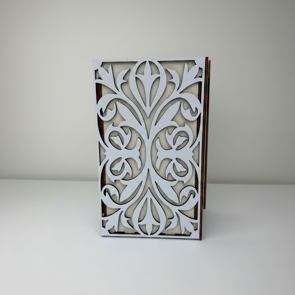 Decorative wooden frame with intricate white cut-out design on a plain background