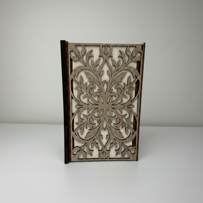 Decorative wooden panel with intricate cut-out design on a white background