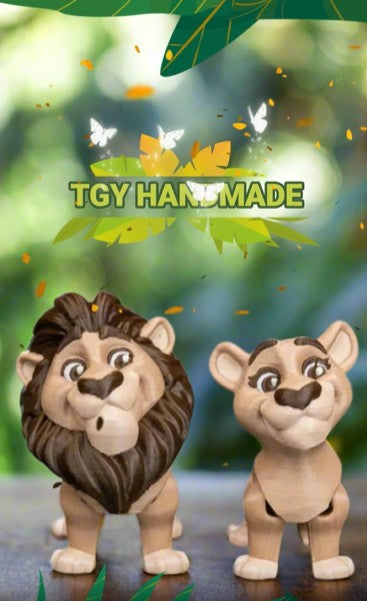 The male and female lion keychains are clipped onto a colorful backpack, swinging gently as if ready to join their owner on an adventure. Their compact size and fun design make them the perfect travel companions for kids or creative adults.